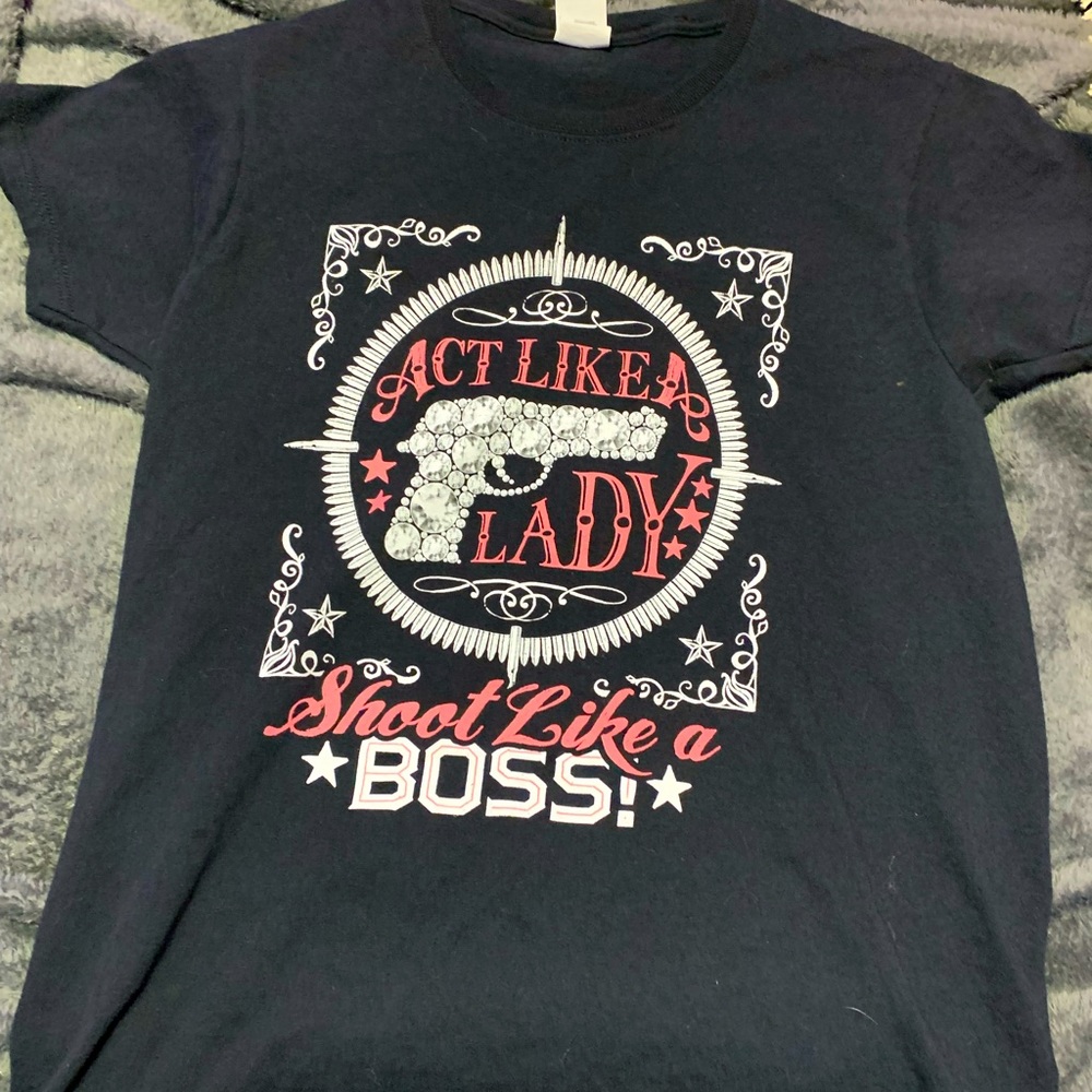 black shirt “act like a lady shoot like a boss”